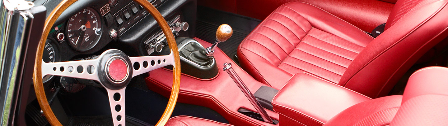 Red interior of a retro, antique car.