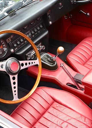 Red interior of a retro, antique car.