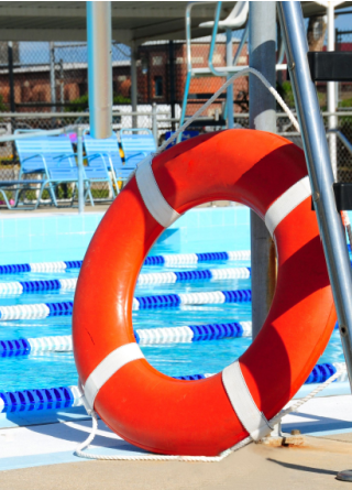 Lifesaving pool ring next to a public swimming pool
