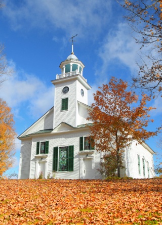 Religious buildings often require unique church insurance coverage, such as this colonial New England church. 