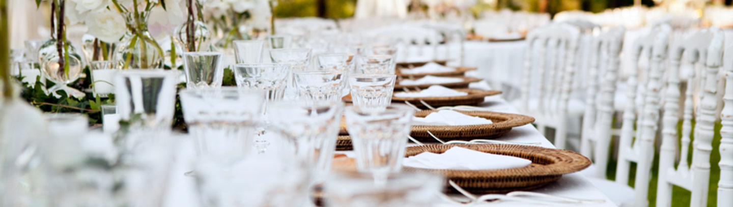 Wedding table ready for dinner for an elegant outdoor event.