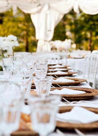 Wedding table ready for dinner for an elegant outdoor event.