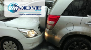 A car rear-ends an SUV on a snowy road. 