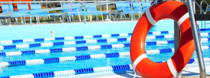 Lifesaving pool ring next to a public swimming pool