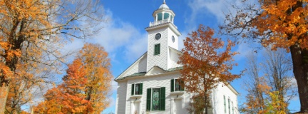 Religious buildings often require unique church insurance coverage, such as this colonial New England church. 
