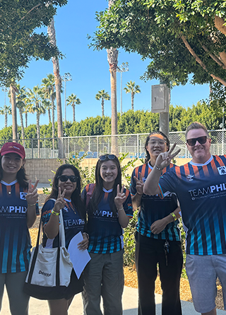 Philadelphia Insurance Companies employees distribute shoes to children in need at the LA Galaxy's stadium.