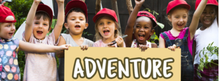 Close-up photo of young campers holding a sign printed with Adventure and a teepee 